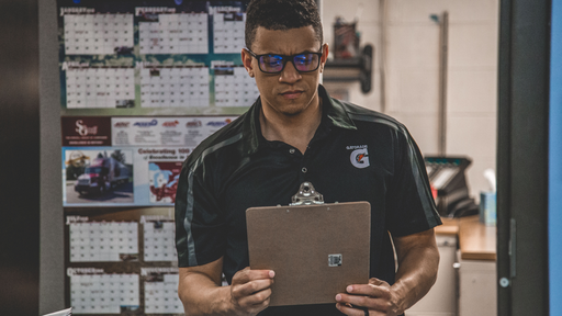 Man Holding Clipboard Inside Room 1543924