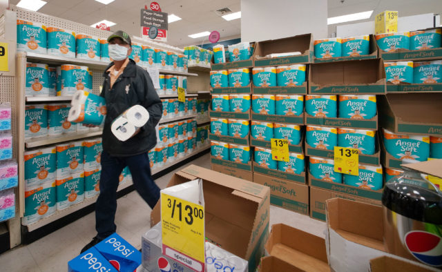 Masked customer (declined ID) grabs his 2 packages of toilet paper at Moiliili Longs Drugs. Limit was 2 per customer. 6 rolls for $13.99