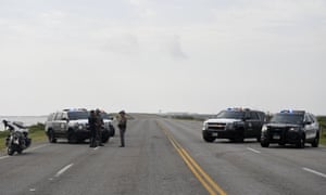 Police block an entrance to Naval Air Station-Corpus Christi after the shooting incident on Thursday