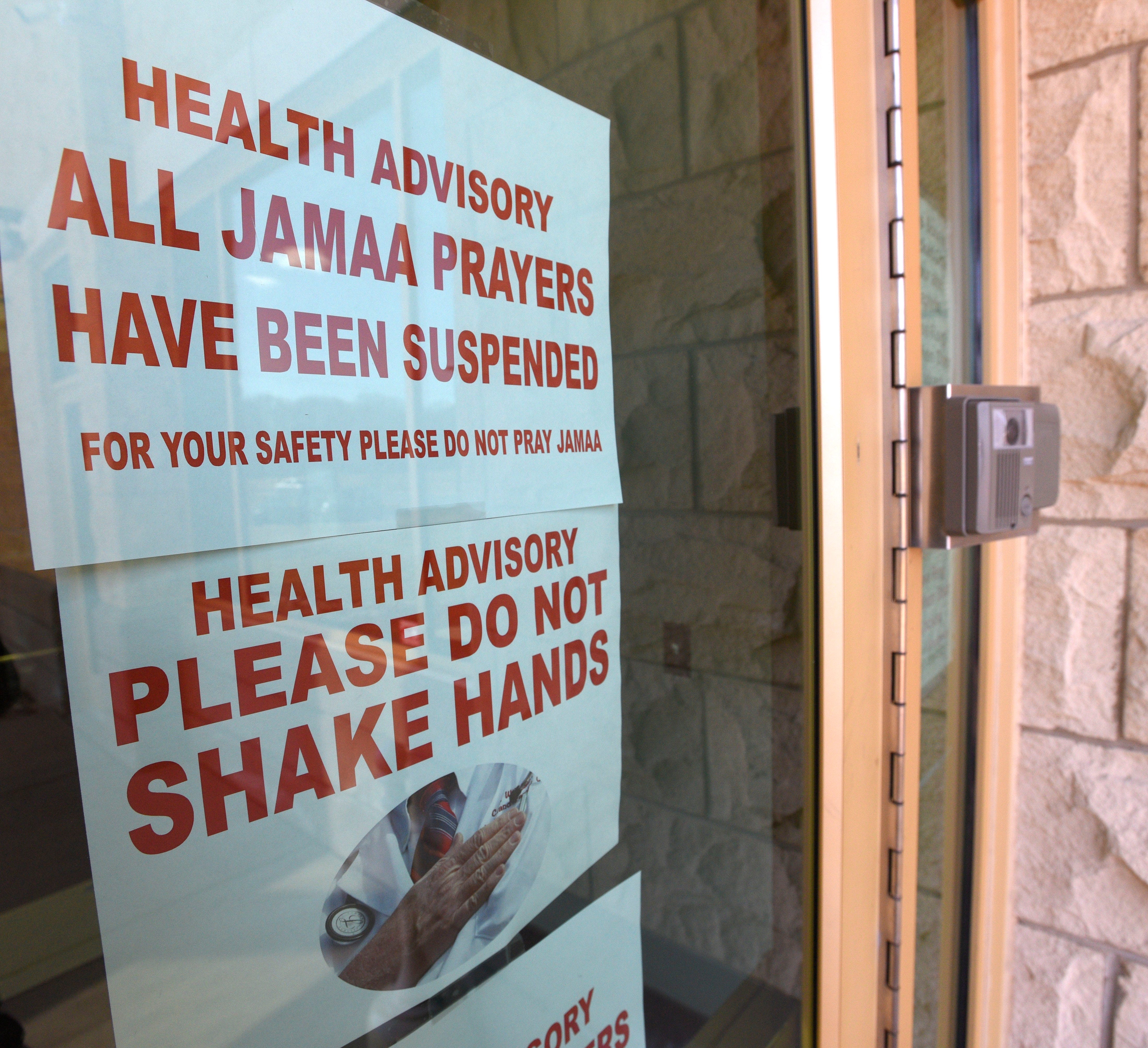 Personal protection instructions are posted on the office doors to the Islamic Center of America.