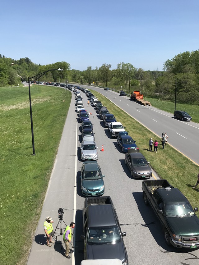 Cars waiting in line to receive food on the Beltline Tuesday in Burlington - SALLY POLLAK
