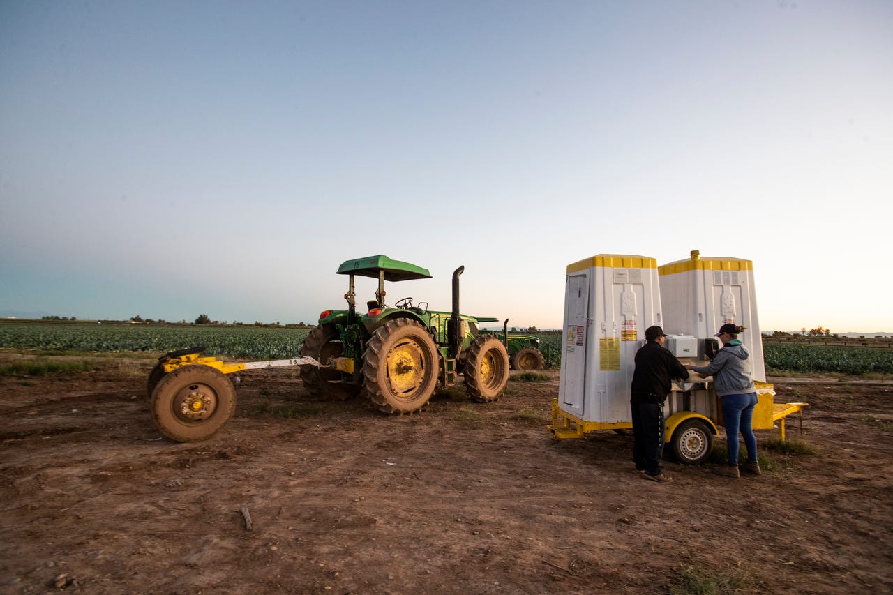 Farmers wash their hands as they prepare to start their day harvesting Romanesco cauliflower in Imperial Valley in March.