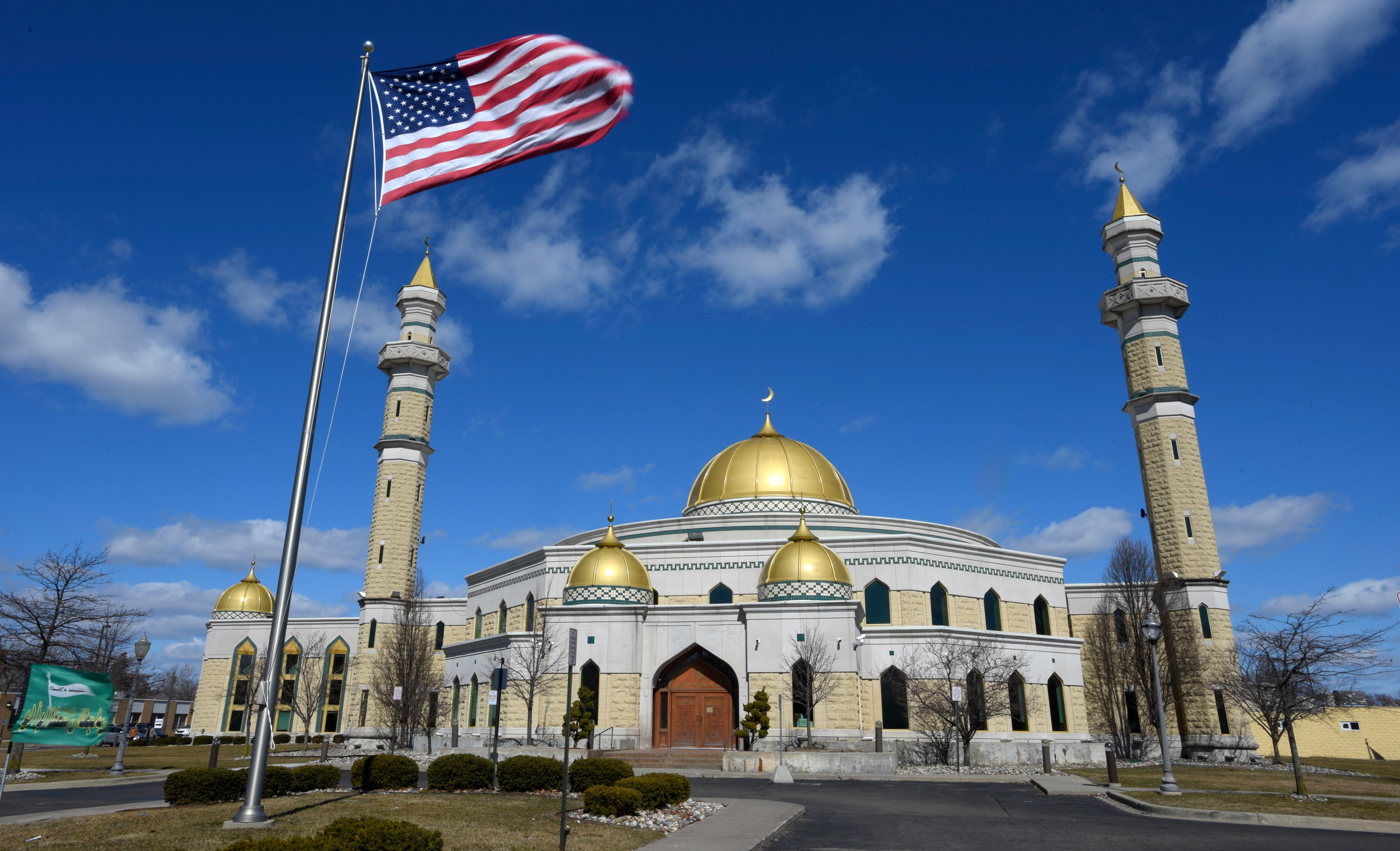 The United States flag blows in the wind in front of the Islamic Center of America in Dearborn. Prayers have been suspended, Friday afternoon, March 13, 2020, at the Islamic Center of America in Dearborn, until further notice, to help prevent the spread of coronavirus.