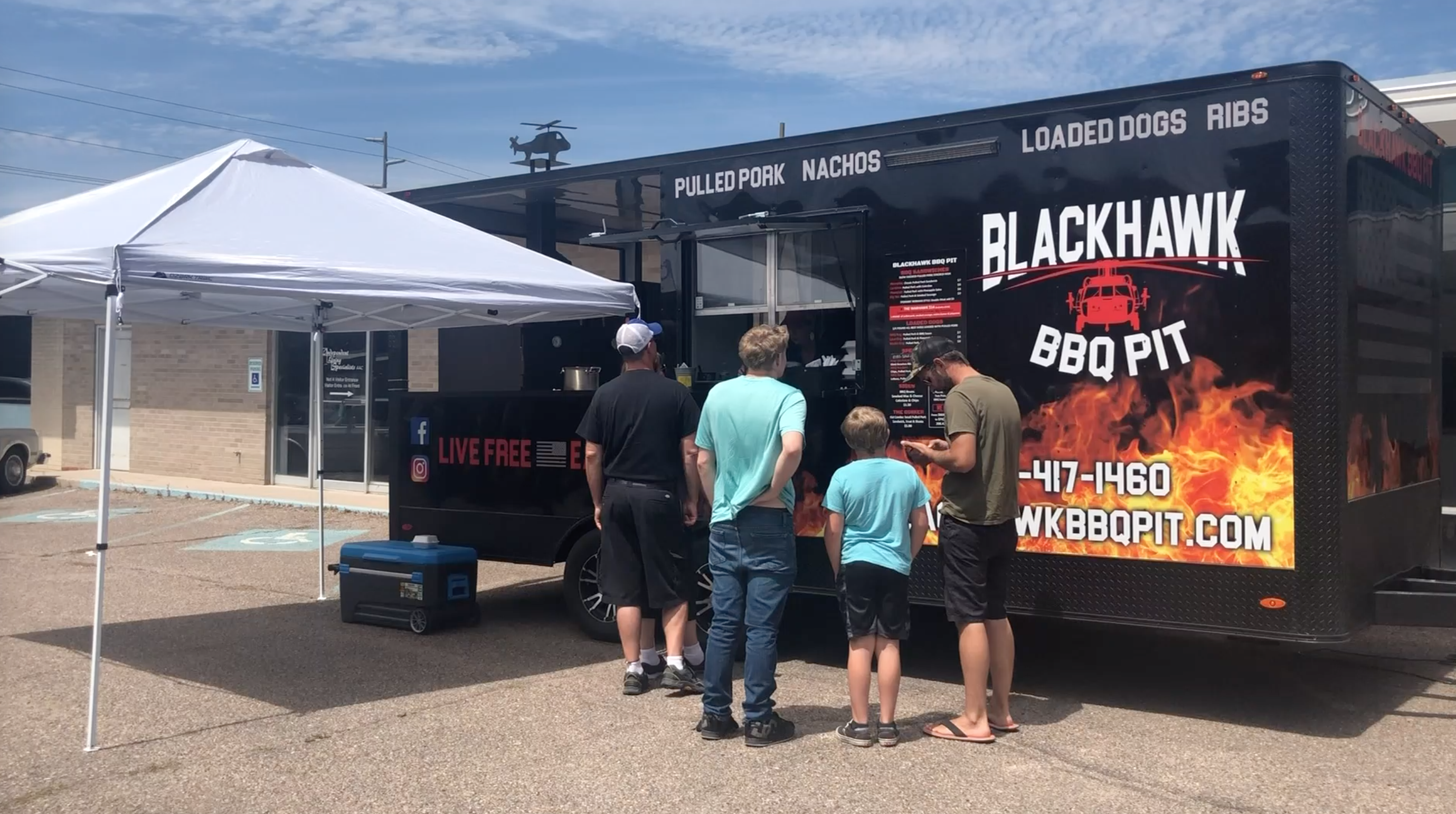 blackhawk bbq pit truck serves customers