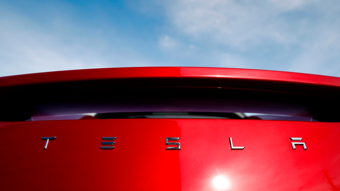 In this April 15, 2018 file photo, the sun shines off the rear deck of a roadster on a Tesla dealer&apos;s lot in the south Denver suburb of Littleton, Colo. Tesla has picked Austin, Texas, and Tulsa, Oklahoma, as finalists for its new U.S. assembly plant, a person briefed on the matter said Friday, May 15, 2020.