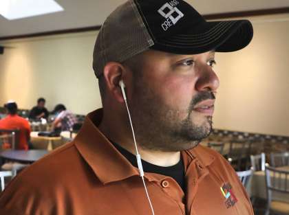 Gregorio Palomino CEO of CRE8AD8, takes a call while his team, to the left, contact food suppliers Thursday. Palomino’s company has received a $39 million contract from the U.S. Department of Agriculture to create and distribute food boxes to food banks and nonprofits during the coronavirus pandemic.