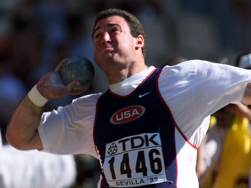 Andy Bloom of the US competes in the Shot Put at the seventh world track and field championships in Seville, Spain, Saturday Aug.21, 1999.(AP Photo/Thomas Kienzle)