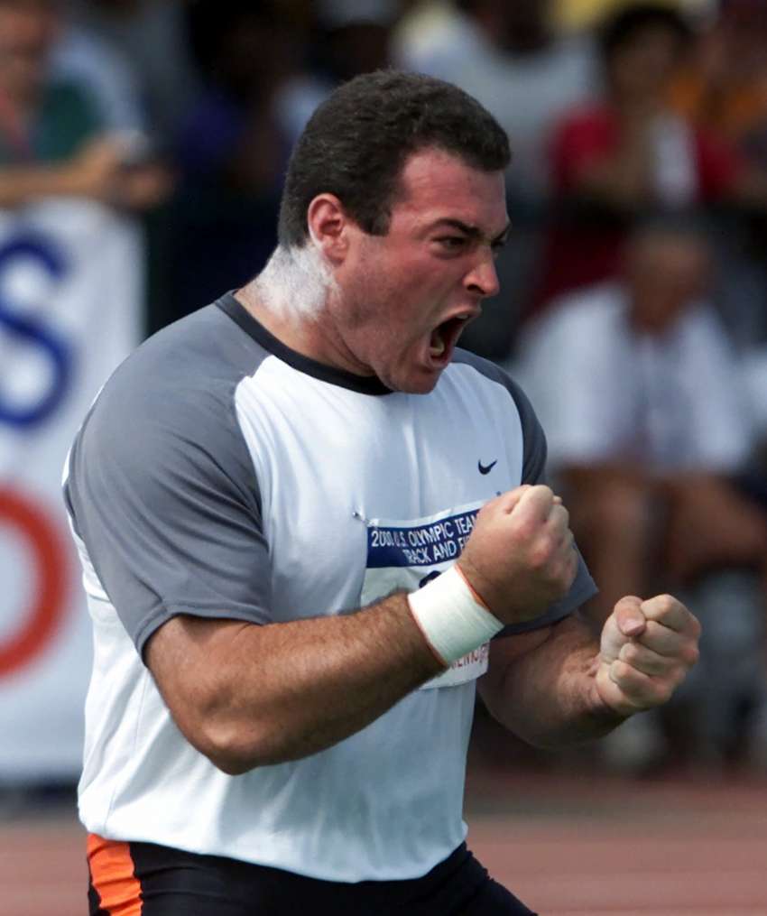Andy Bloom celebrates his third place finish in the shot put at the U.S. Olympic Track and Field Trials in Sacramento, Calif., Saturday, July 15, 2000.