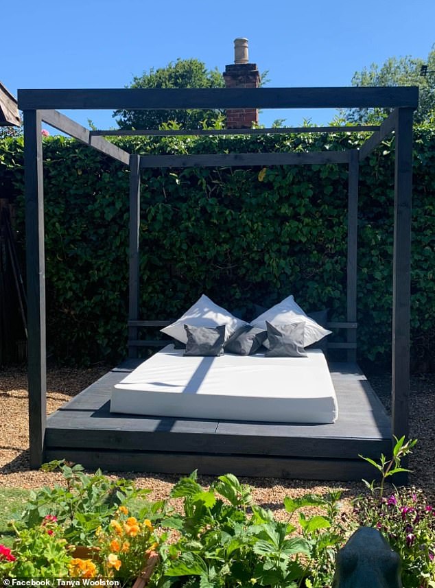 The large bed, pictured here before the curtains and lamps were added, is perfect for lounging in the garden