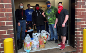 Logistics Plus employees with surgical masks