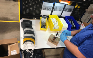 Raymond employee assembling face mask