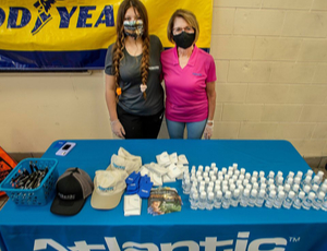 Atlantic Logistics employees with hand sanitizer