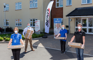 Seko Logistics employees delivering donated PPE