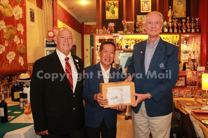 Pres. Dieter Reigber of the Rotary Club Eastern Seaboard receives his allotment of face masks from DG Maruai Jintabunditwong.
