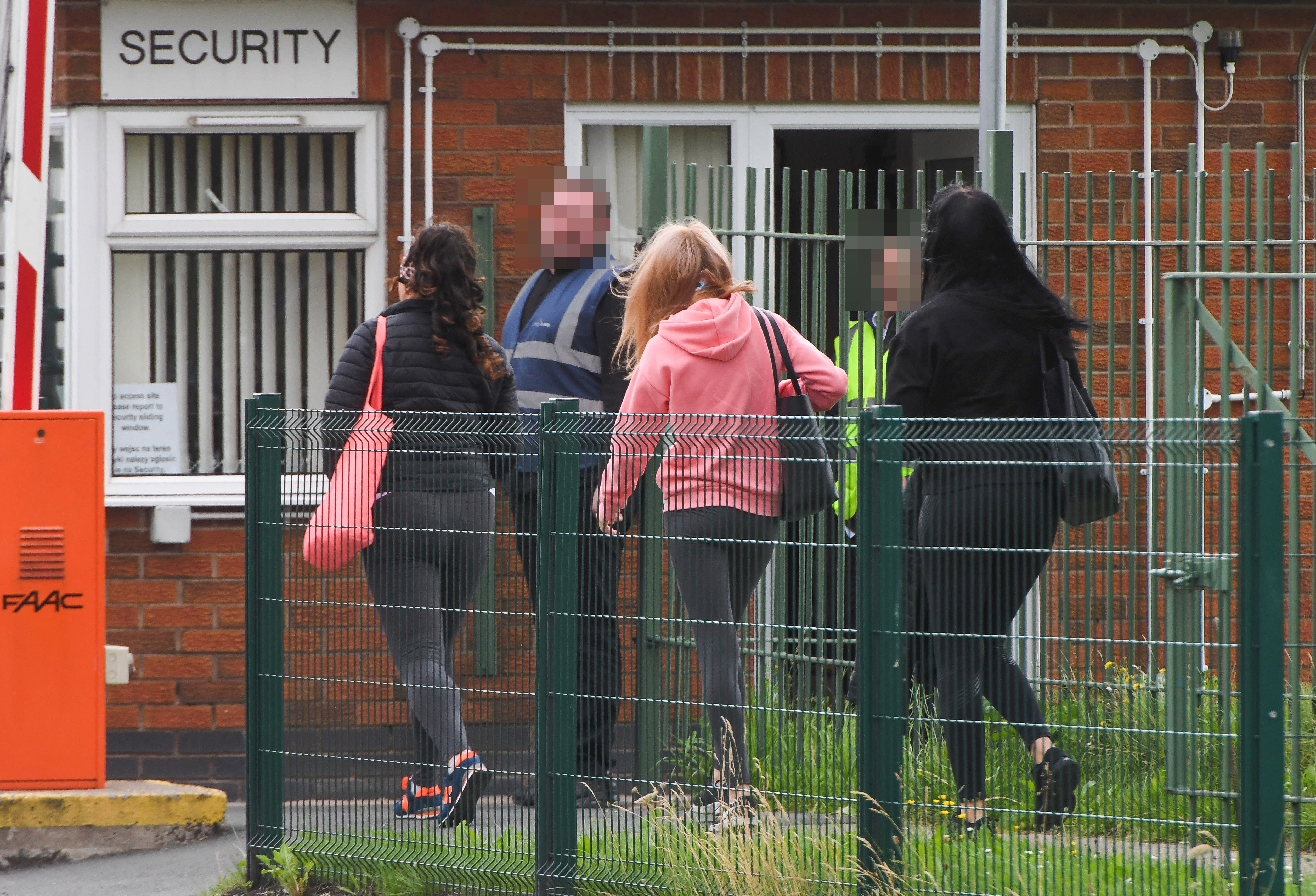 Staff arrived in cars together and were then told to keep their distance as they walked in