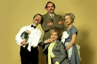 The Fawlty Towers cast: Andrew Sachs as Manuel; John Cleese as Basil; Connie Booth as Polly; Prunella Scales (siting) as Sybil.