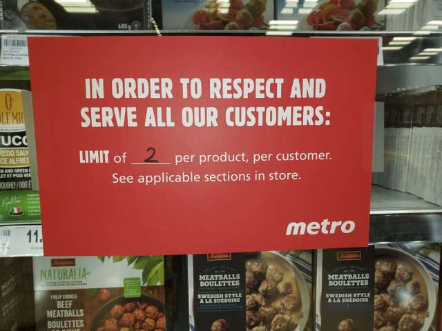 Signs limiting frozen food purchases at a Metro in Toronto in March.