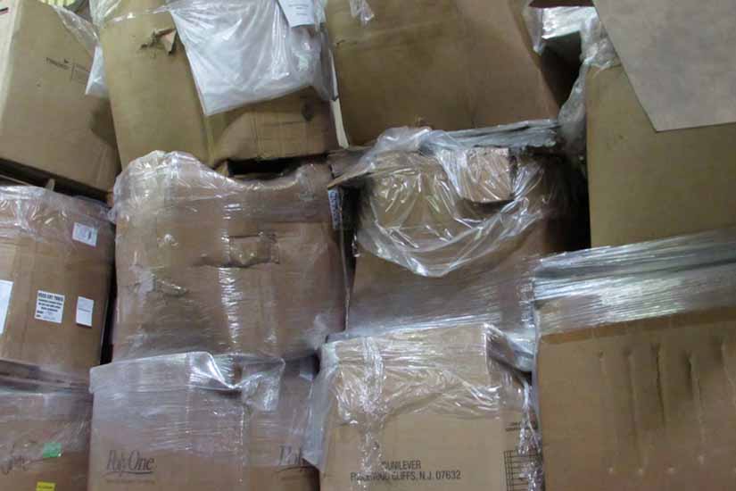 Boxes of CRT material stacked haphazardly in the former Closed Loop facility.