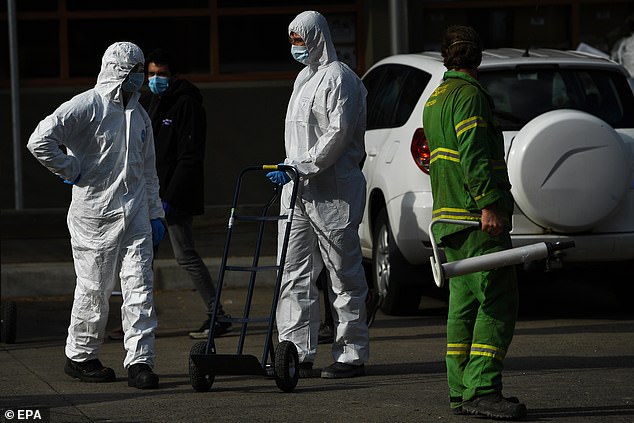 Just 30 of Victoria's new cases are linked to known outbreaks, with 135 remaining under investigation. Pictured: Health workers outside Melbourne public housing tower