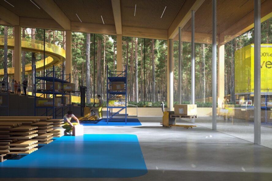 rendering of furniture factory interior with glass walls revealing views of a forest