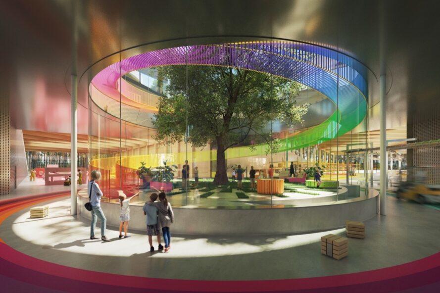 rendering of people around rainbow glass wall revealing view of a large tree