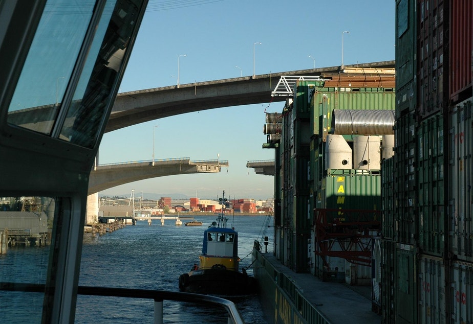 caption: Western Towboat pulls freight barges for Alaska Marine Lines, the dominant cargo hauler to Southeast Alaska. The trickiest part of the journey is at the very beginning when the freight barges must pass the bridges at the mouth of the Duwamish Waterway.