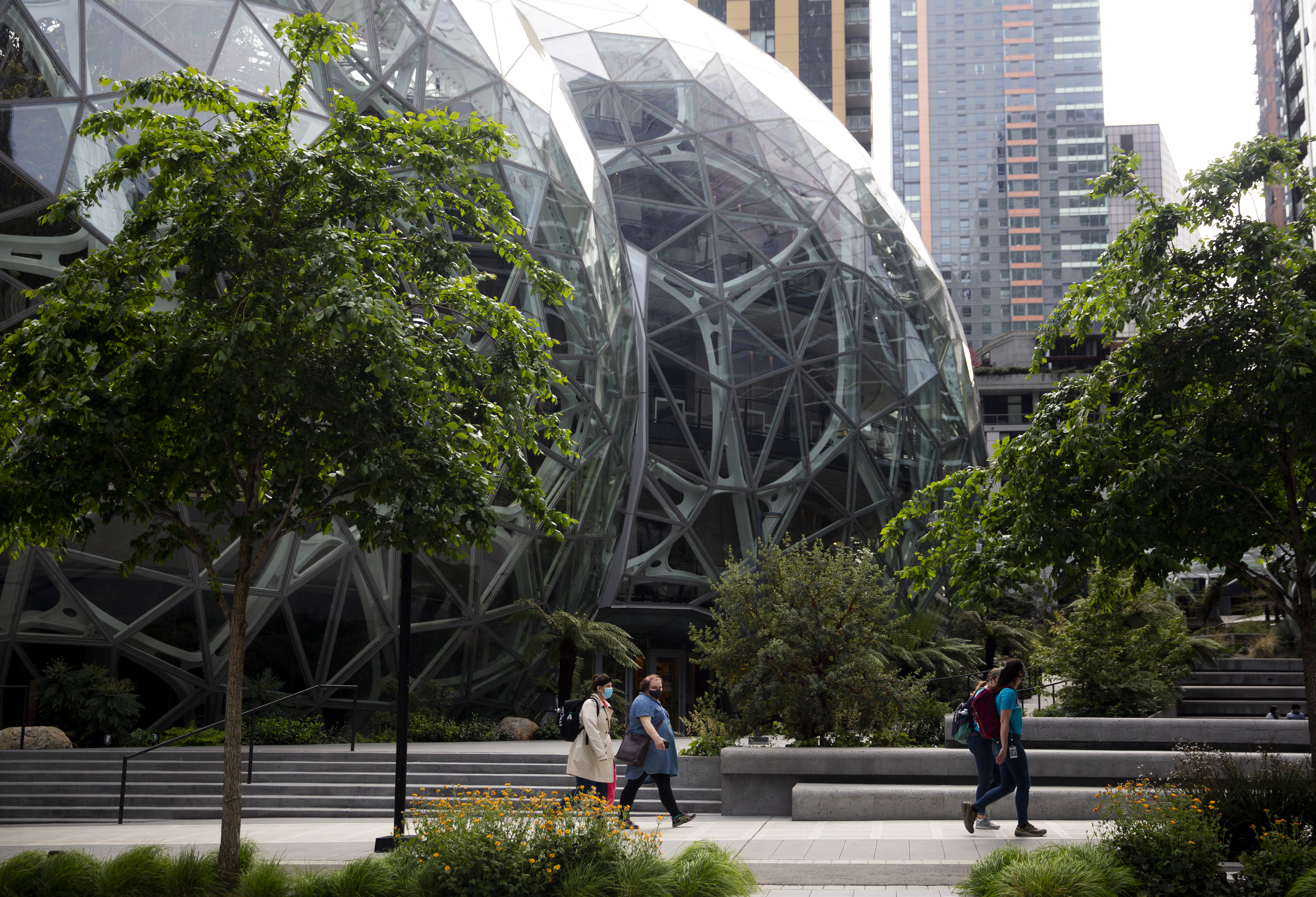 People wearing masks outside the Amazon campus in Seattle, Wash., on April 30, 2020. People wearing masks outside the Amazon campus in Seattle, Wash., on April 30, 2020.