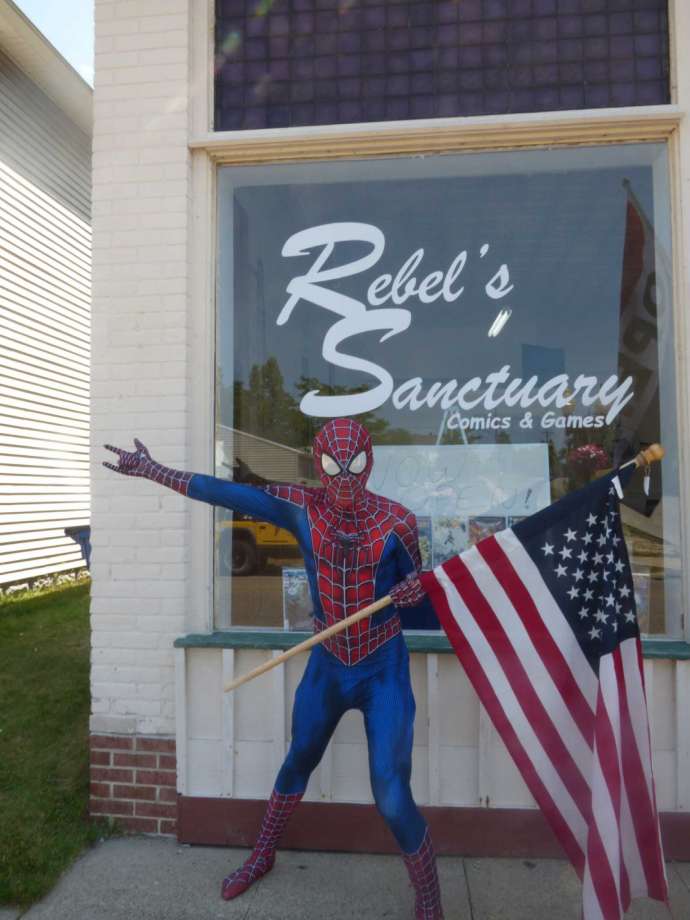 Spiderman welcomes customers over Fourth of July weekend to Rebel's Sanctuary, a new comic book shop in Manistee. (Scott Fraley/News Advocate)