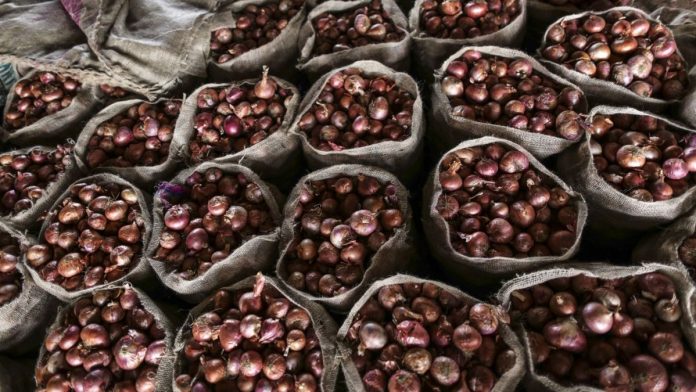 Inside An Onion Storehouse As India Prepares To Import Onions As Prices Surge Gunny bags of onions | Dhiraj Singh/Bloomberg
