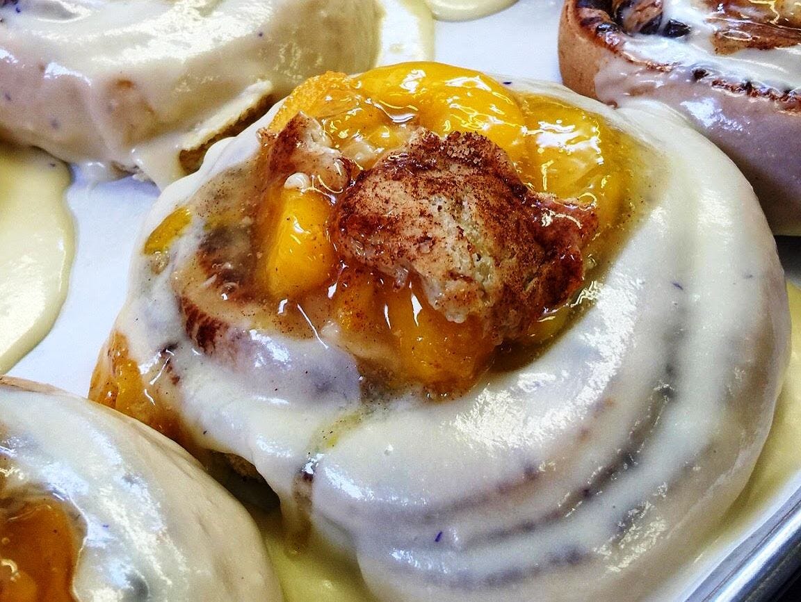 Cinnamon rolls stuffed with peach cobbler from the Peach Cobbler Factory.
