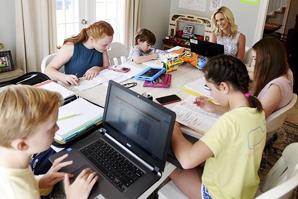 Cathlean Snyder, top right, a teacher in the Caddo Parish schools in Louisiana, was juggling a full-time online teaching load, and helping her five children with their school assignments, during the coronavirus school closures. When the 2020-21 school year begins, many teachers across the country will be juggling remote teaching and child care responsibilities again.