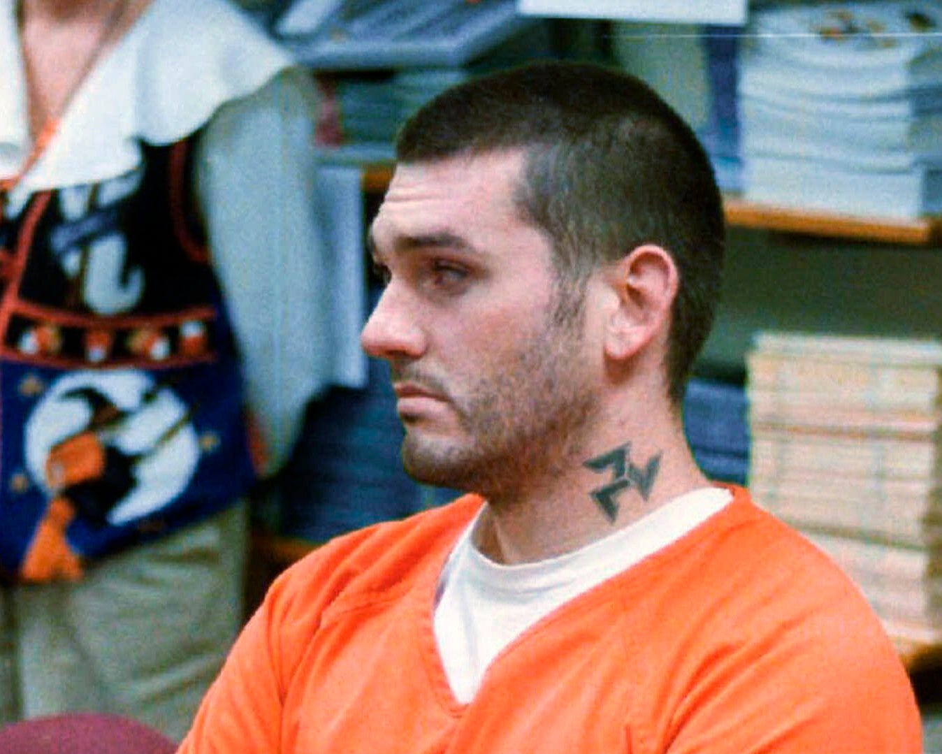 FILE - In this Oct. 31 1997, file photo, Daniel Lewis Lee waits for his arraignment hearing for murder in the Pope County Detention Center in Russellville, Ark. On Tuesday, July 7, 2020, family members of the victims of Lee, who is scheduled to be put to death next week, asked a federal judge to delay his execution, saying the coronavirus pandemic puts them at risk if they travel to attend it. (Dan Pierce/The Courier via AP, File)