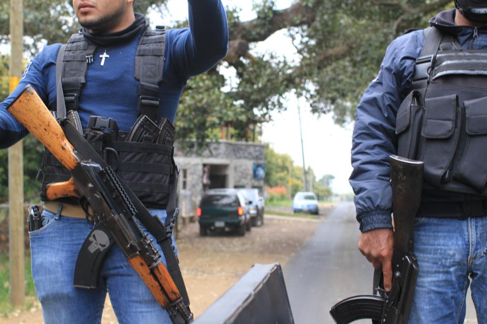 Gunmen ride through Michoacan, Mexico. 
