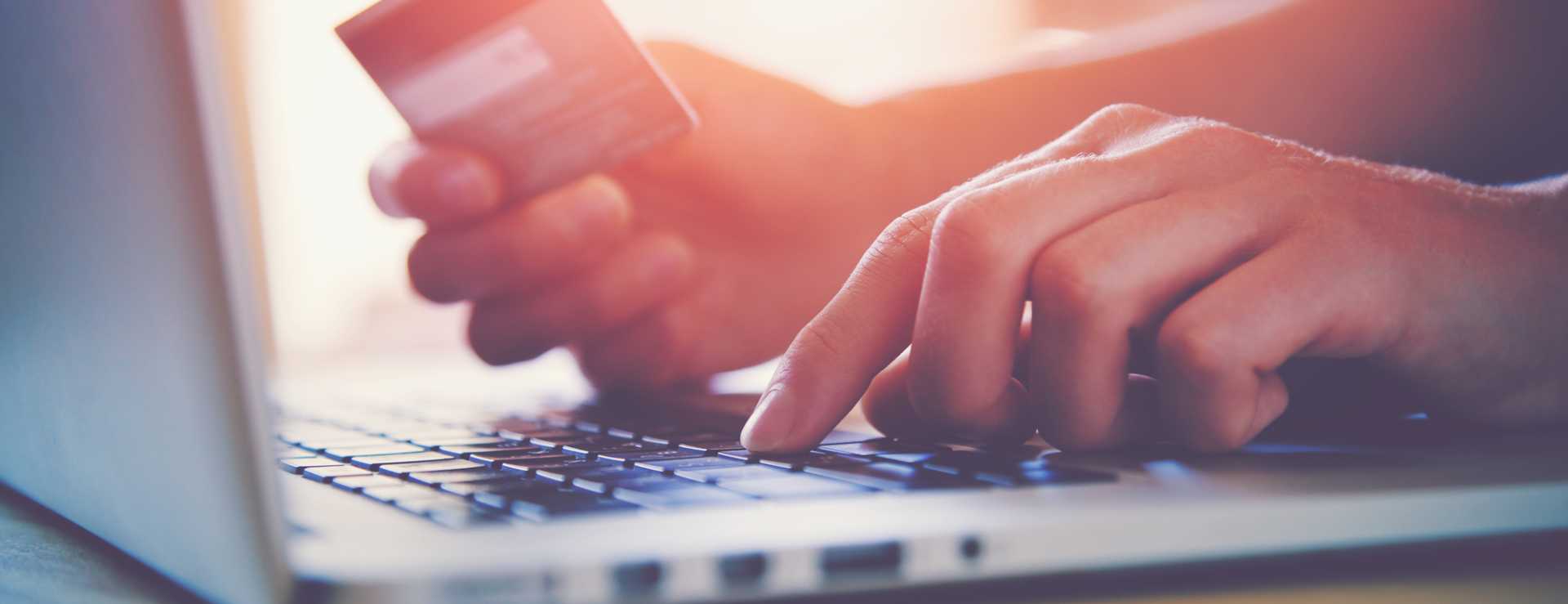 CROP - b2b buyers Hands holding credit card and using laptop. Online shopping ecommerce internet - image courtesy of Depositphotos.