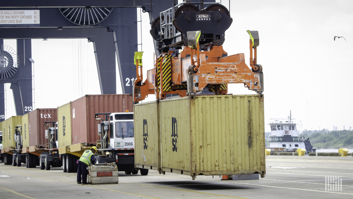 A container held by a crane at a U.S. port.
