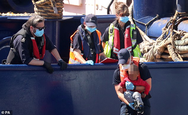 Almost 4,000 migrants have crossed the Channel to the UK so far this year. Pictured: Children are picked up by the Border Force vessel Hunter after being brought into Dover, Kent on small boats crossing the English Channel on Friday