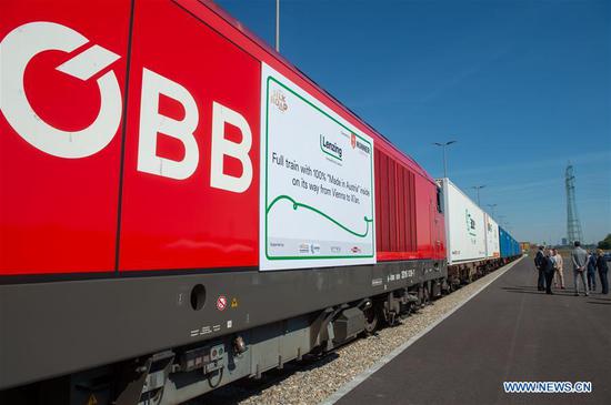 A freight train with "Made in Austria" goods leaves the Vienna South Terminal for China, in Vienna, Austria, on Aug. 20, 2020. A train loaded with fibers and pulp used for textiles pulled out of the Vienna South Terminal heading for China on Thursday, marking the first time a train with goods exclusively "Made in Austria" going from the Alpine country to China. (Photo by Georges Schneider/Xinhua) A freight train with "Made in Austria" goods leaves the Vienna South Terminal for China, in Vienna, Austria, on Aug. 20, 2020. A train loaded with fibers and pulp used for textiles pulled out of the Vienna South Terminal heading for China on Thursday, marking the first time a train with goods exclusively "Made in Austria" going from the Alpine country to China. (Photo by Georges Schneider/Xinhua)