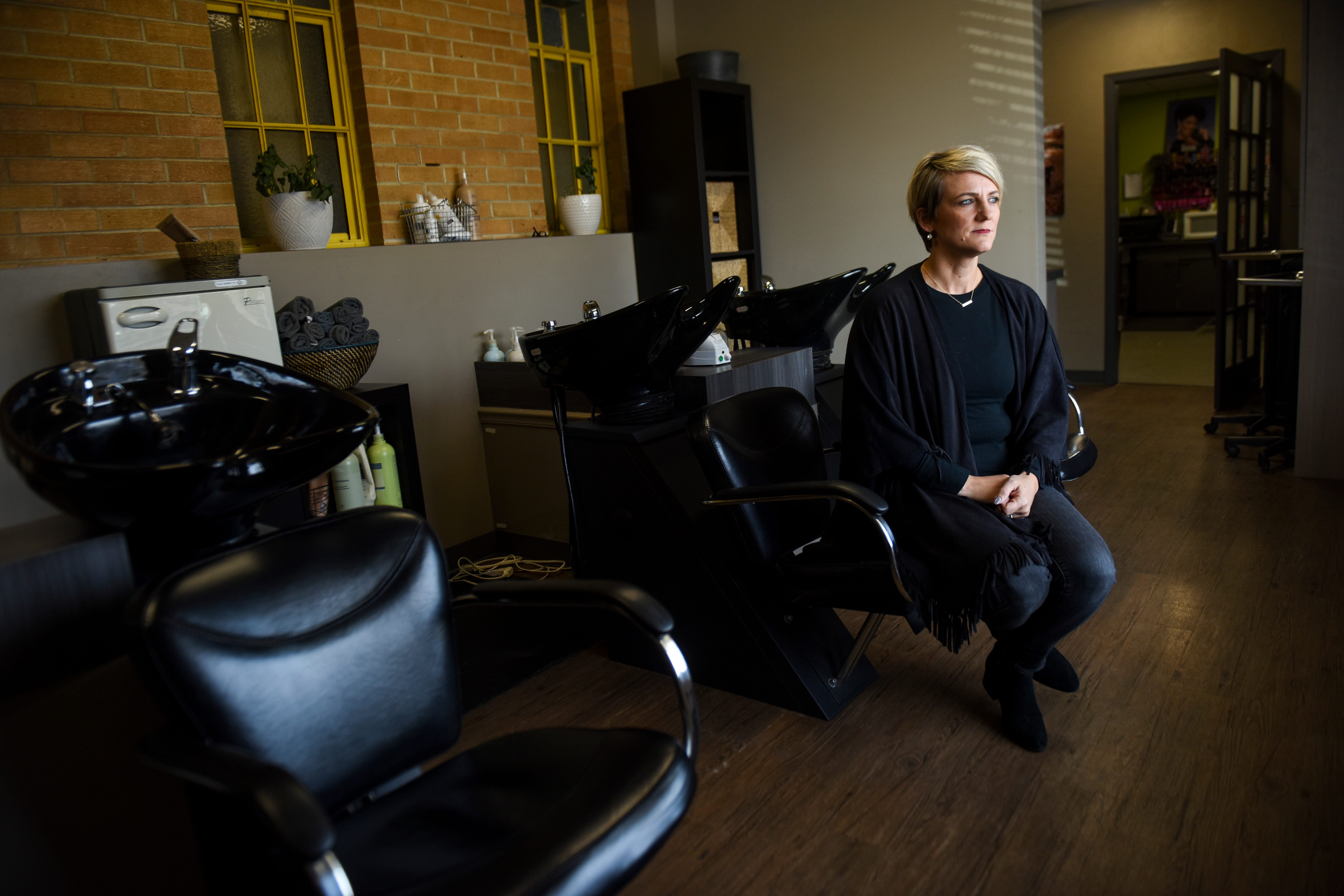 Gloria Kolbeck, owner of Vanessen's Hair Design salons poses for a portrait on Thursday, March 26, 2020 in Sioux Falls. Kolbeck has begun screening people coming into the salon and has implemented changes to adhere to the CDC guidelines on the coronavirus. 