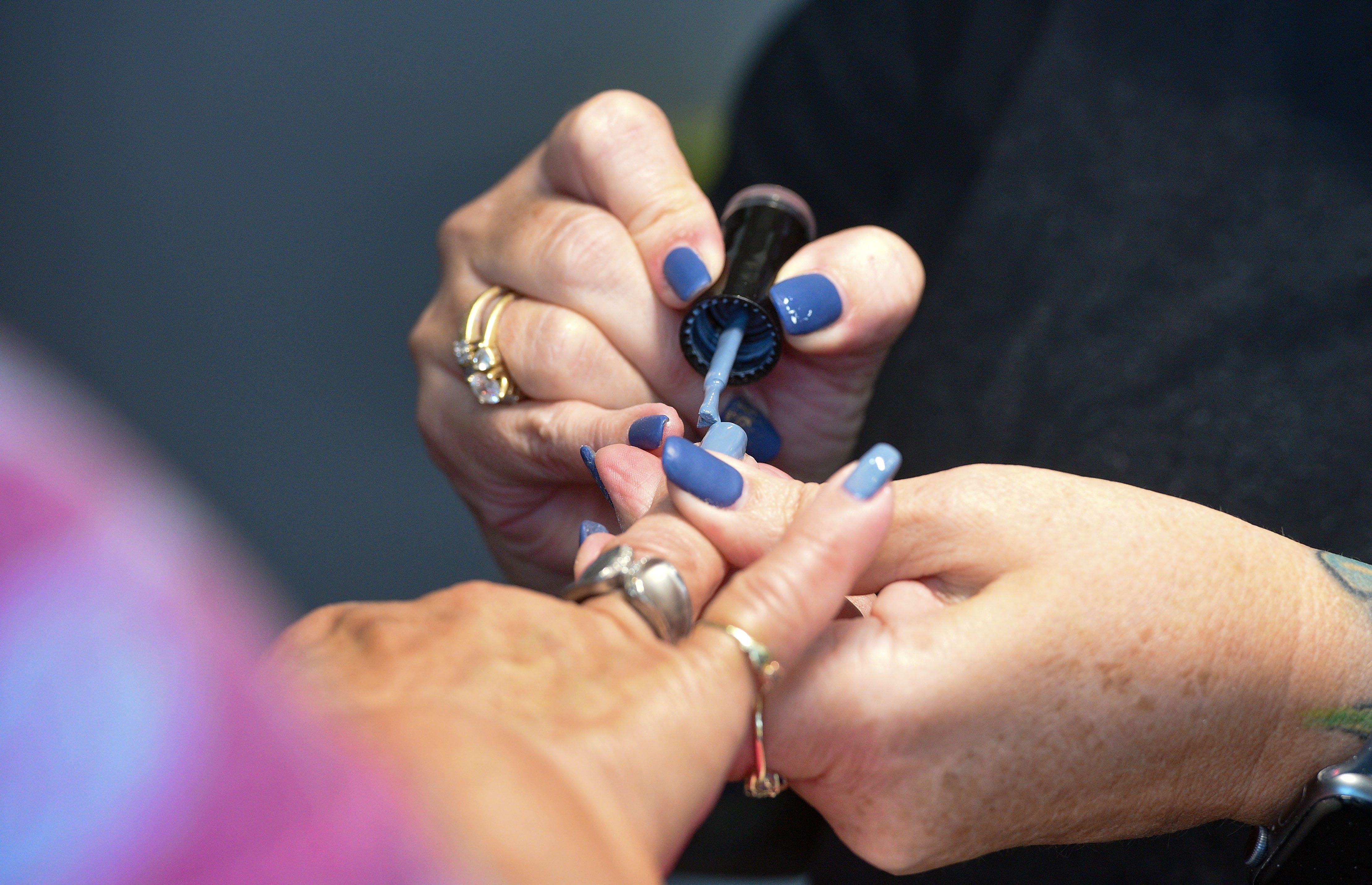 Nail technician Carrie Melow applies polish for Tammy Browne's manicure on Thursday, August 27, at Perfect 10 Nail and Beauty Bar in Sioux Falls.