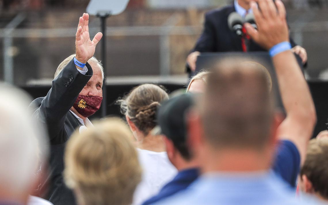 Former Duluth mayor Gary Doty waves to the crowd after being recognized during Vice President Mike Pence's campaign visit to Lake Superior Warehousing Friday in Duluth. (Clint Austin/caustin@duluthnews.com)