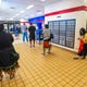 Patrons wait in a long line winding through the interior of the U.S. Postal Service's John Pangelinan Gerber Post Office Building in Barrigada on Friday, Aug. 28. 2020.