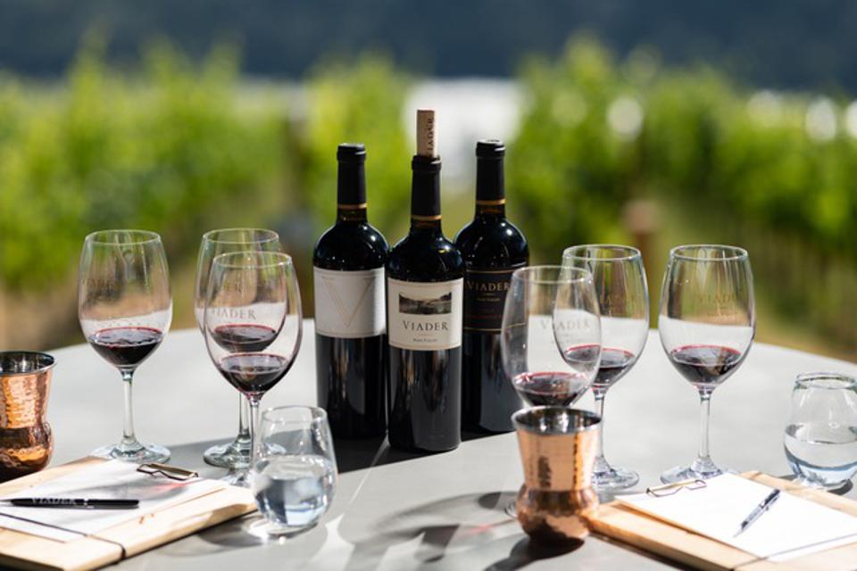 A flight of VIADER wines is poured on the terrace of their Howell Mountain tasting room.