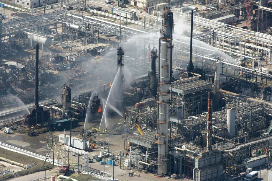 Firefighters spray water on a smoldering unit following an explosion that killed 15 people and injured more than 170 at the BP refinery in this March 23, 2005, file photo in Texas City, Texas. Internal documents show that budget cuts and a lack of leadership contributed to significant safety problems at BP PLC's Texas City plant, the site of the deadly explosion, federal investigators said Monday, Oct. 30, 2006. Photo: BRETT COOMER, MBR / AP / Internal