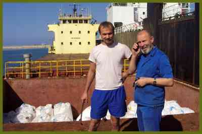 Boris Prokoshev (right) and boatswain Boris Musinchak next to a freight hold loaded with ammonium nitrate in the port of Beirut in 2014