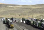 In this Aug. 3, 2004, file photo, garbage, hauled in by train, is unloaded onto trucks for transfer to the Arlington, Ore., landfill.