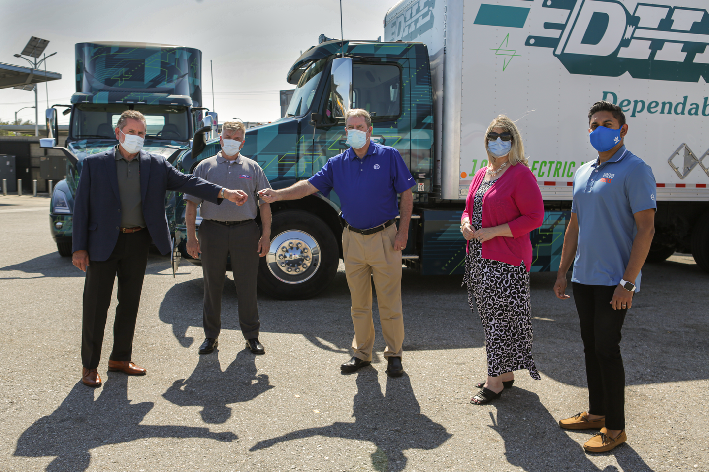 General manager of Volvo Trucks North America’s TEC Equipment dealership, Mike Reardon, hands over the keys to the first Volvo VNR Electric Class 8 truck models to Joe Finney with Dependable Highway Express. From left to right: Joe Finney, COO at Dependable Highway Express; Troy Musgrave, director of process improvement at Dependable Highway Express; Mike Reardon, general manager at TEC Equipment; Janice Rutherford, county supervisor of San Bernardino County and South Coast Air Quality Management District board member; Aravind Kailas, advanced technology policy director at Volvo Group North America.