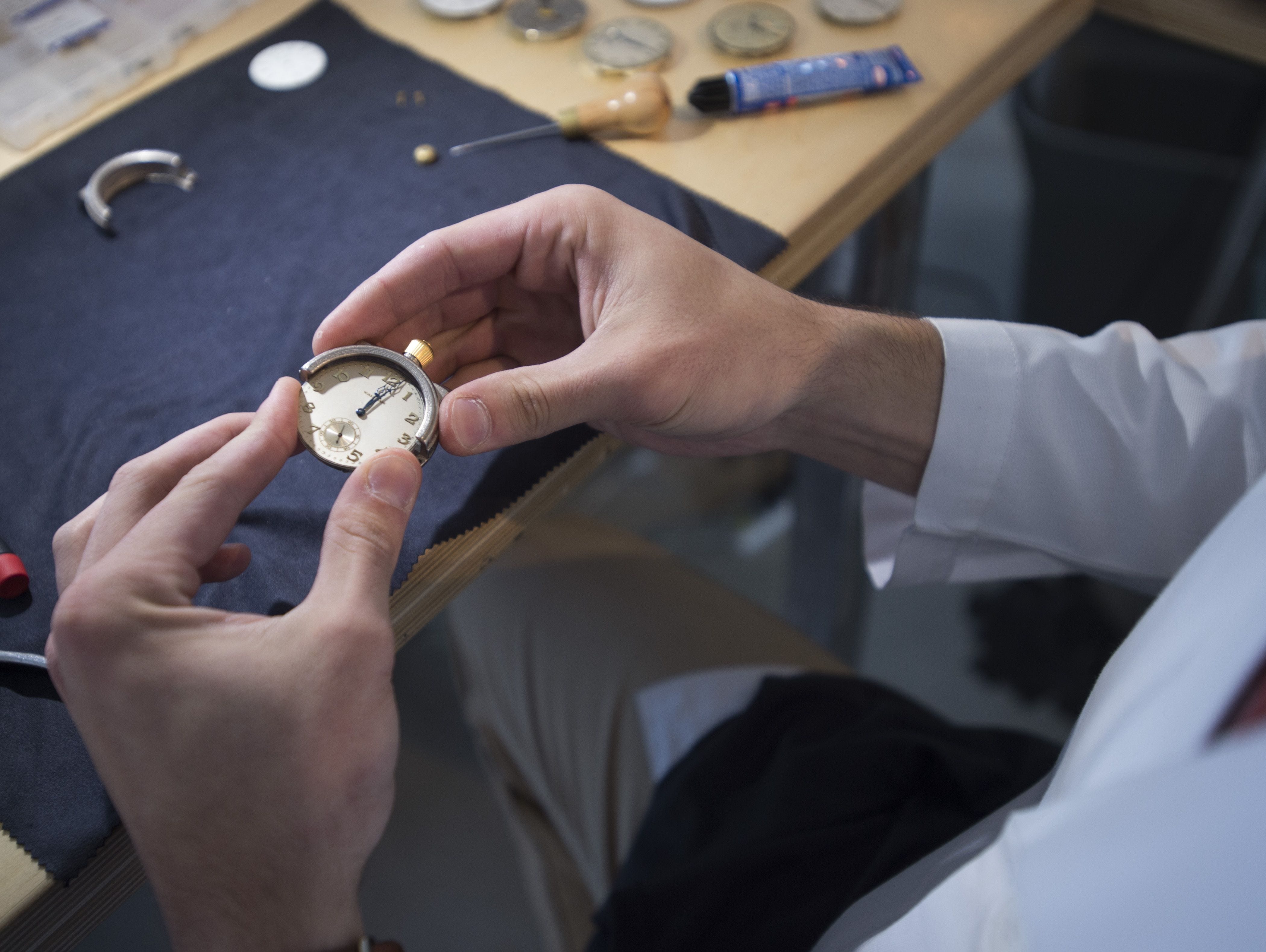 Tyler Wolfe assembles a watch at the Vortic Watch headquarters in 2015. The company, based in Fort Collins, restores antique pocket watches turning them into wristwatches.