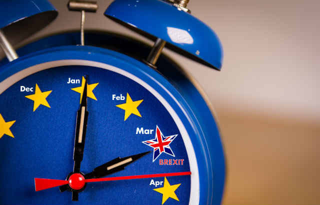 Alarm clock with the colours of the EU flag and one UK star representing the countdown to Brexit.