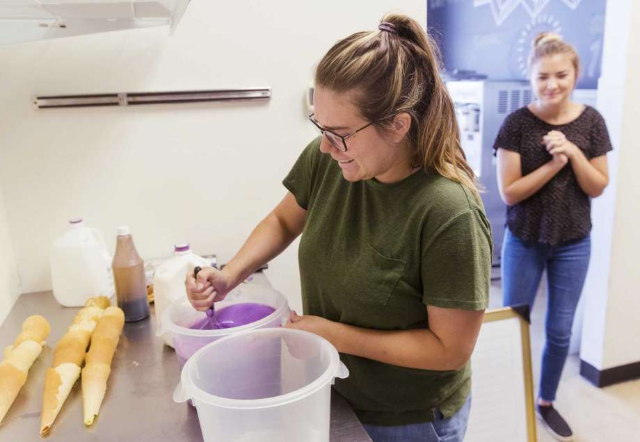 Emily Lewis prepares a batch of ice cream to test out a new batch of homemade waffle cones at The Salted Lemon Market & Creamery Tuesday, Sept. 8, 2020, in Springfield, Ill. Originally, they wanted to purchase cream from Kilgus Farmstead to use in their own soft serve recipe. Now instead, they’ll purchase the basic soft serve mix from the third-generation Fairbury dairy farm. (Ted Schurter/The State Journal-Register via AP) Photo: Ted Schurter, AP / (C) The State Journal-Register
