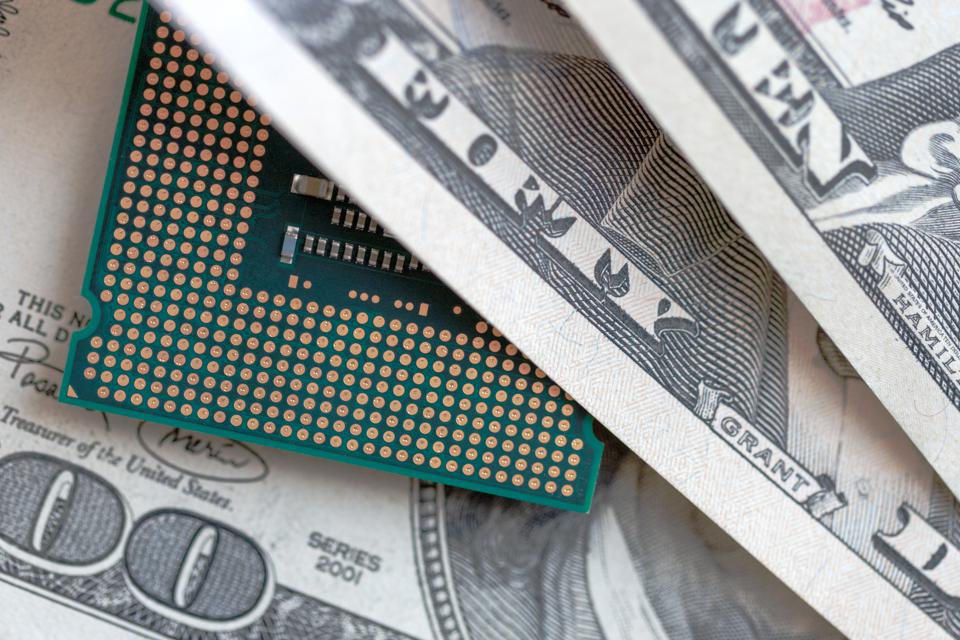 desktop cpu on dollars currency background. concept of technology price.